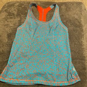 Lululemon athletic tank top size 2 or XS. Bright orange and teal